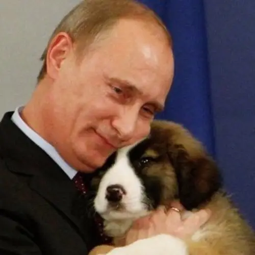 Vladimir Putin Cuddles With A Puppy