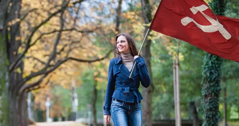 Woman Looking Forward To Flavors Of Fall, Beautiful Foliage, And An Uprising Of The Proletariat Reminiscent Of The Communist October Revolution