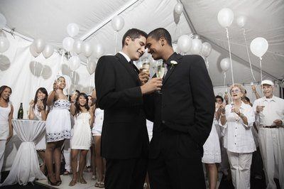 Two bros getting married in front of their friends and family.