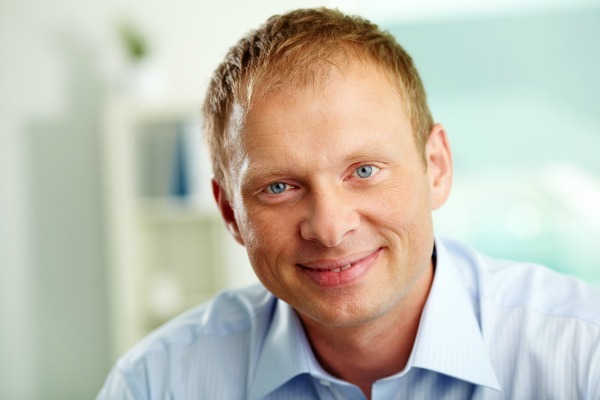 Portrait Of Handsome Businessman Looking At Camera